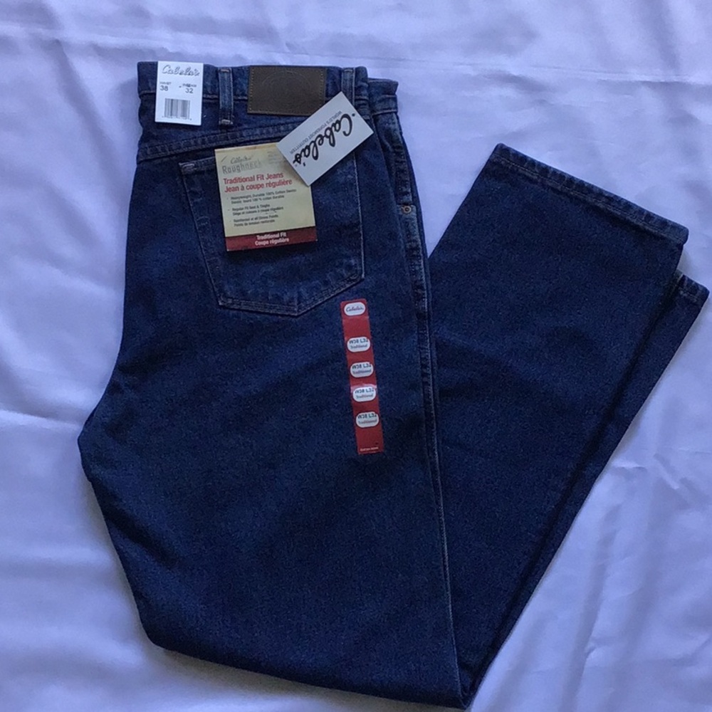 Brand new, with tags, Cabela’s men’s dark blue jeans.